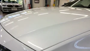 Close-up of a glossy white coating on a smooth surface