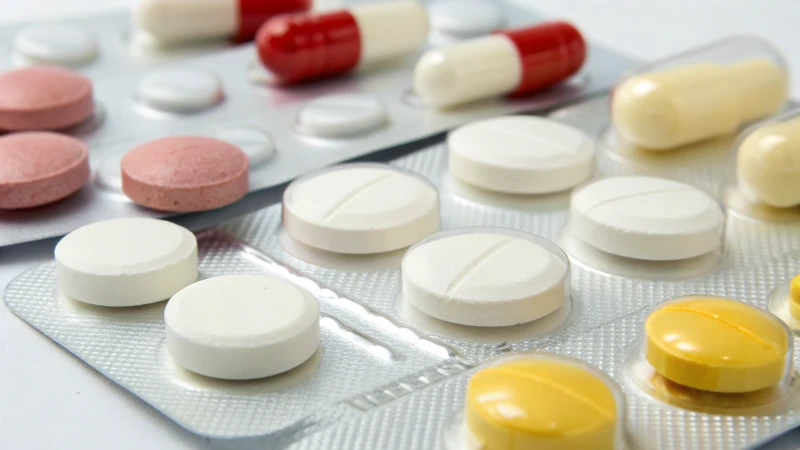 A collection of colorful pharmaceutical tablets on a clean surface.